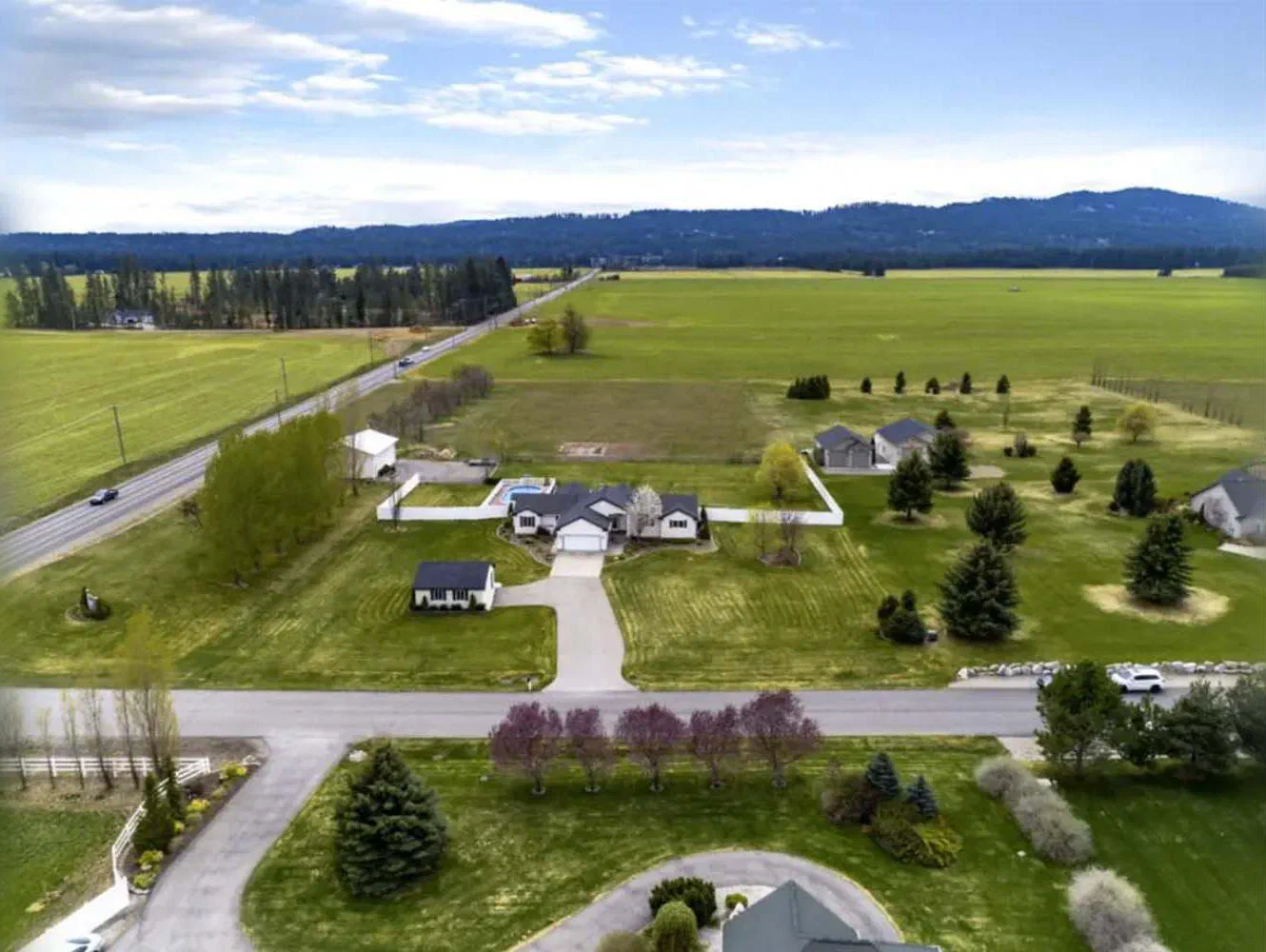 Aerial view of homes and open fields on the Rathdrum Prairie